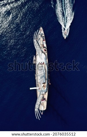 Aerial drone photo of massive and Super Yacht Maltese Falcon sail boat cruising in the deep blue Aegean sea in Mykonos, Greece