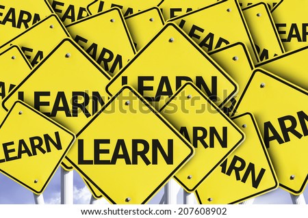Learn written on multiple road sign