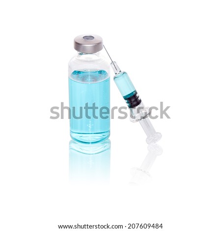 Injecting medicine with a vial and glass syringe Royalty-Free Stock Photo #207609484