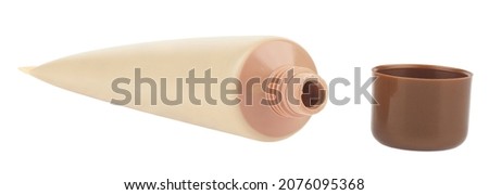Tube with tonal cream isolated on white background. Detail for design. Design elements. Macro. Full focus. Background for business cards, postcards and posters