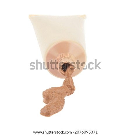 Tube with tonal cream isolated on white background. Detail for design. Design elements. Macro. Full focus. Background for business cards, postcards and posters