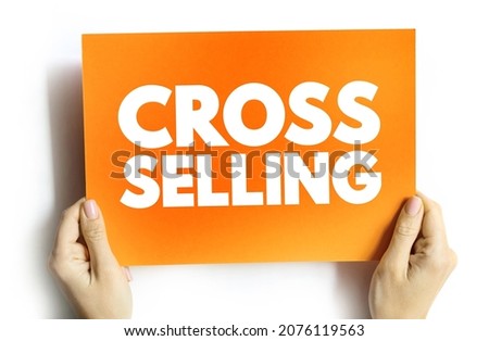 Cross Selling - action or practice of selling an additional product or service to an existing customer, text on card