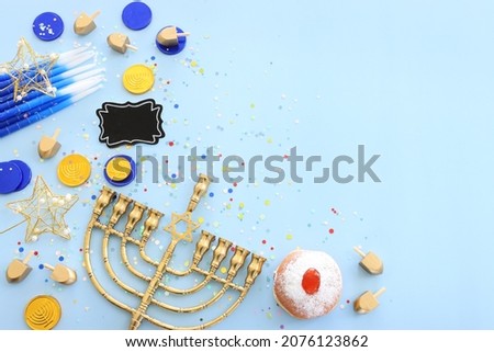Religion image of jewish holiday Hanukkah background with menorah (traditional candelabra), spinning top and candles