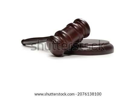 Wooden judge gavel and soundboard isolated on a white background. Justice of law system conceptual. Royalty-Free Stock Photo #2076138100