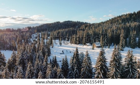 Beautiful sunrise from above in Triglav national park Pokljuka with fresh snow Royalty-Free Stock Photo #2076155491