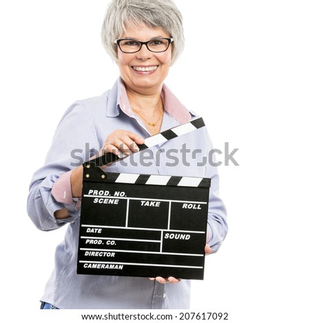 Happy elderly woman holding a clapboard, isolated on white background