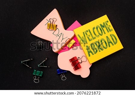 Conceptual caption Welcome Abroad. Concept meaning something that you say when someone gets on ship Multiple assorted collection office stationery photo placed over table