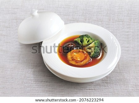Braised abalone with broccoli and mushroom Royalty-Free Stock Photo #2076223294