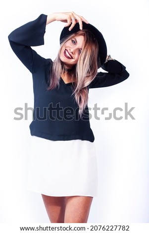 young pretty brunette girl hipster in hat on white background casual emotional posing smiling, lifestyle people concept