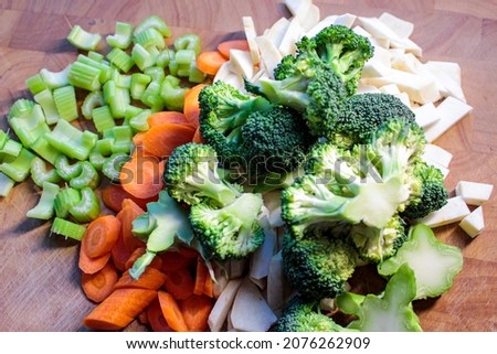 Various fresh vegetables, sliced vegetables.