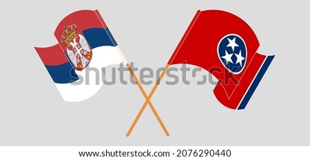 Crossed and waving flags of Serbia and The State of Tennessee. Vector illustration