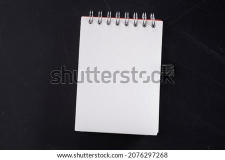 close up blank spiral note pad  