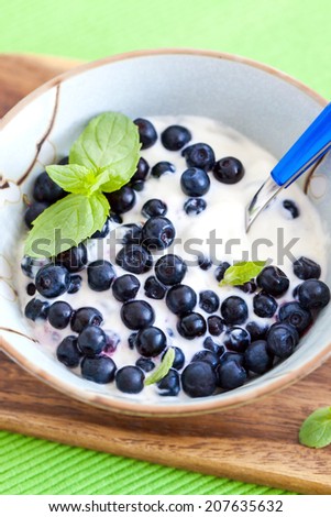 Fresh yogurt with blueberry and mint  for breakfast 