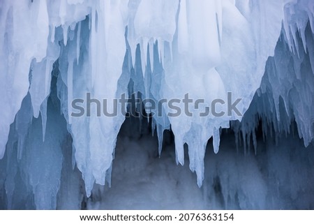 icicles hanging down in the cave  
 Royalty-Free Stock Photo #2076363154