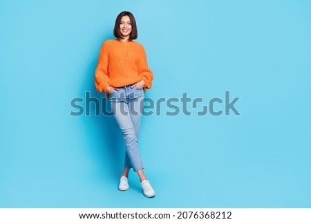 Full length body size view of attractive cheerful girl posing copy empty space isolated over bright blue color background Royalty-Free Stock Photo #2076368212
