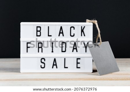 Black Friday sale. Label and lightbox on a dark background.
