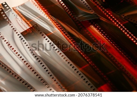 Cut strips of photographic color film. Close-up of color negatives.