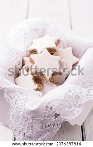 zimtstern - homemade traditional german cookies with nuts and icing sugar glaze