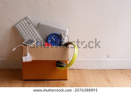 Obsolete electronic gadgets or e-waste in paper boxes , Reuse and Recycle concept. Royalty-Free Stock Photo #2076388891