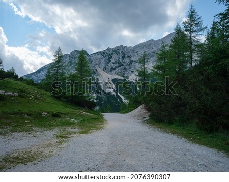 summer mountain tops and peaks under blue cloudy sky in Slovenia national Triglav park. sunny summer day