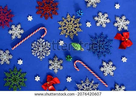 Christmas texture with New Year's toys and accessories on a blue background.