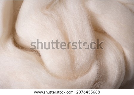 Wool texture closeup. Detailed texture with natural woolen white Royalty-Free Stock Photo #2076435688