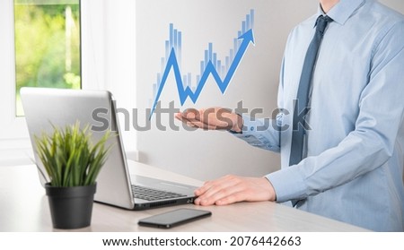 Businessman hold sales data and economic growth graph chart. Business planning and strategy. Analysing trading of exchange. Financial and banking. Technology digital marketing.Profit and growing plan