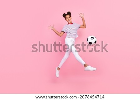 Full size photo of childhood afro american stylish trendy lady wear casual clothes jump football gamer isolated on pink color background Royalty-Free Stock Photo #2076454714