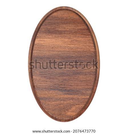 Wooden oval frame. Blank wooden frame with wooden backing on a white background. Round empty frame. The layout of the sign. Bulletin board.