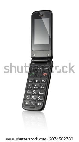Simple black flip cellphone, isolated Royalty-Free Stock Photo #2076502780