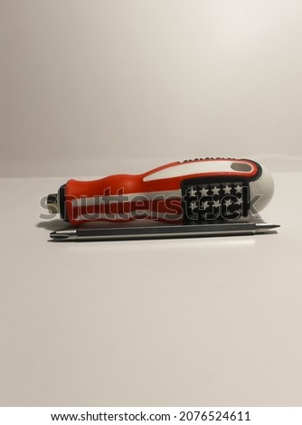 Photo isolated white a set of screwdriver tye minus and plus in one