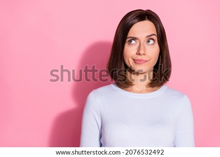 Photo of doubtful uncertain young lady dressed white jumper looking empty space thinking about vaccination isolated pink color background