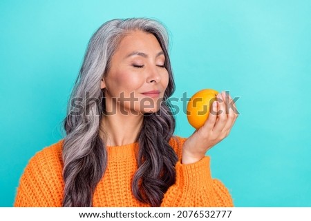 Profile side photo of mature lady aroma smell citrus eco organic calories isolated over teal color background