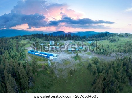 Autumn in the Carpathians, Ukraine. Beech and coniferous forests are picturesque and colorful, oil bases and hydrocarbon pumps are ready for winter, helicopter bird's eye view