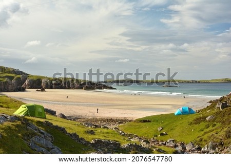 Camping tents in Ceannabeine Beach (traigh allt chailgeag) in the Scottish Highlands. North Coast 500, Durness, Sutherland, Scotland Royalty-Free Stock Photo #2076547780