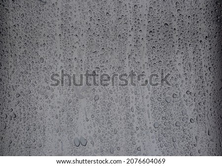 Real background: raindrops on a metal mirror surface. Horizontal shot