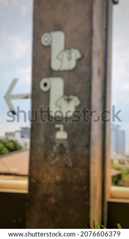 Defocused Abstract Background of Toilet sign outdoor minimalis.jpeg