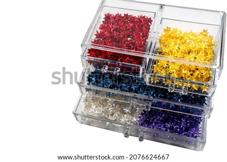 The Floding paper stars. Colorful pattern in the box drawer.