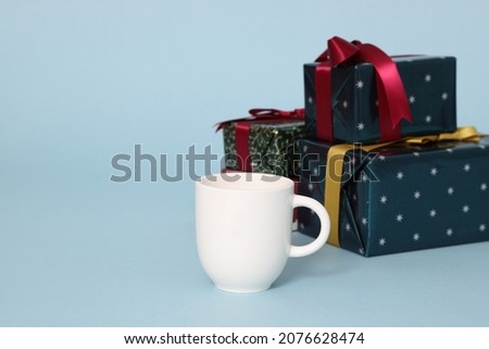The isolated Christmas gifts on the blue background.
