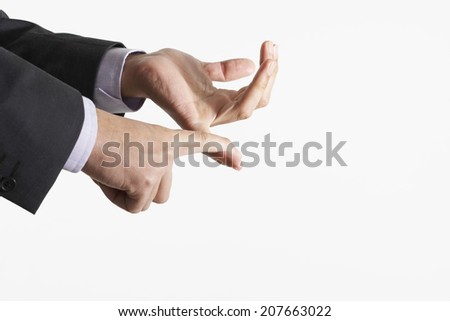 Closeup of business hands counting using fingers against white background