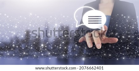 Email marketing concept. Sending newsletter. Hand touch digital screen hologram Email and sms sign on city light blurred background. Symbol marketing or newsletter concept
