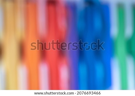 unfocused colorful wallpaper on a white base