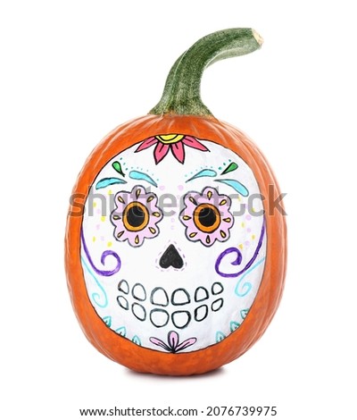 Pumpkin with painted skull on white background. Celebration of Mexico's Day of the Dead (El Dia de Muertos)