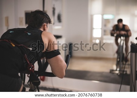 a young athlete doing sports with an electrostimulation vest in a beauty clinic.
EMS stimulation. Royalty-Free Stock Photo #2076760738