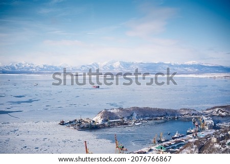 Winter landscape of the Avacha bay. Docks in Petropavlovsk city around showy mountains. Kamchatka peninsula, Russia Royalty-Free Stock Photo #2076766867