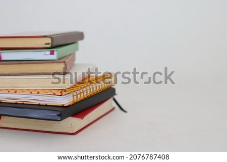 Stack of books on white background