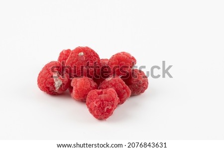 Rotten raspberry isolated on white background. Spoiled raspberries with mold closeup isolated on white background Royalty-Free Stock Photo #2076843631