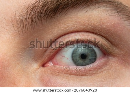 Caucasian male Blue eye macro close up shot. Royalty-Free Stock Photo #2076843928