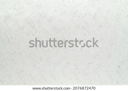 Light-colored paper with microfiber splashes and watermarks