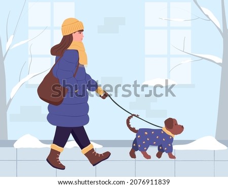 A girl in a down jacket, a hat and a scarf around her neck is walking with a dog down the winter street. A shoulder bag. A small dog in a blue jumpsuit. Vector illustration in flat style.